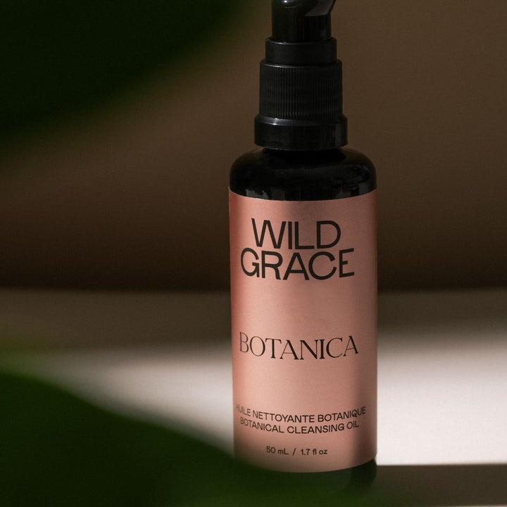 Bottle of Wild Grace Botanica product on a neutral background