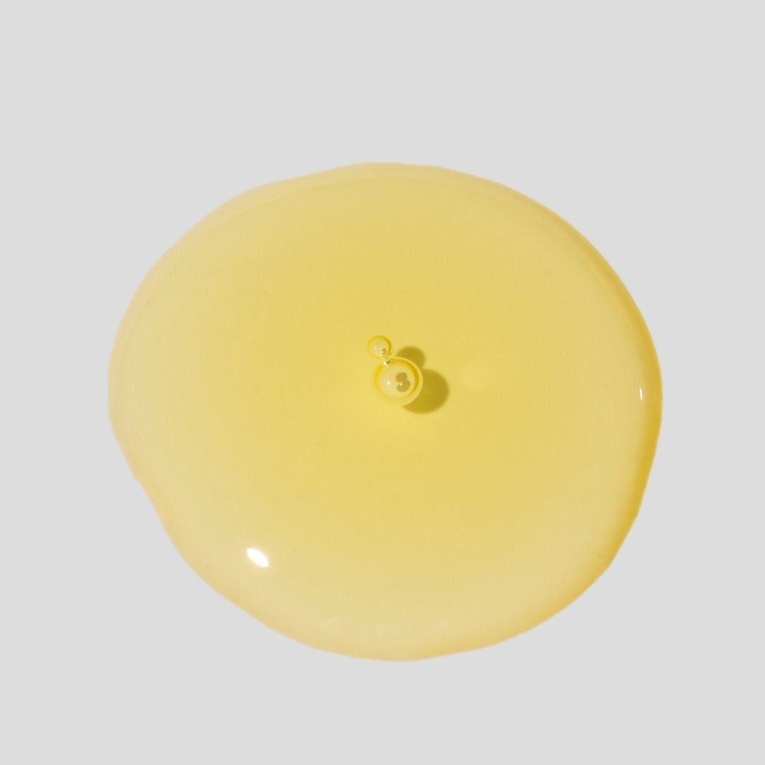 Texture of our BOTANICA Cleansing oil on a light gray background