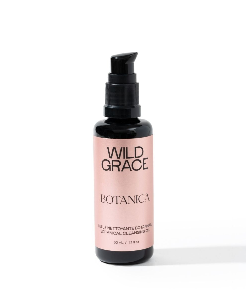 Black bottle of Wild Grace Botanica cleansing oil on a white background