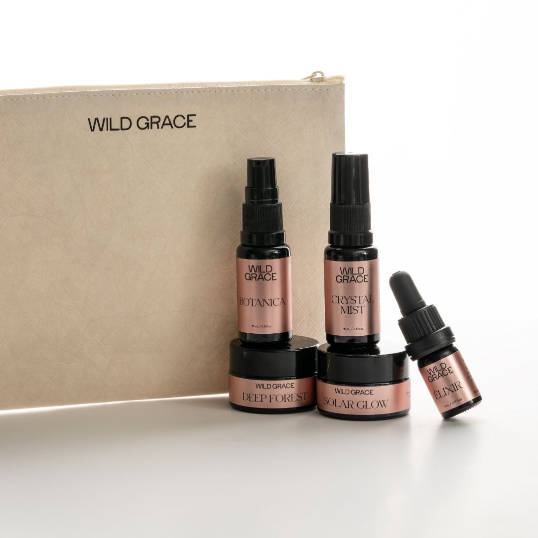 Wild Grace skincare products including bottles and a pouch on a white background