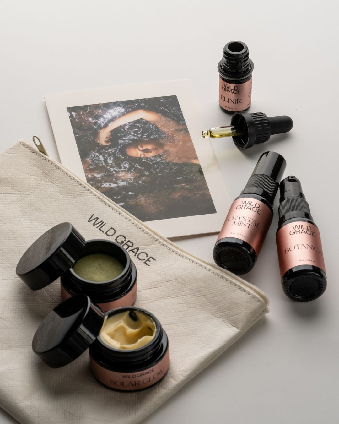 Cosmetic products including jars, bottles, and a pouch with &