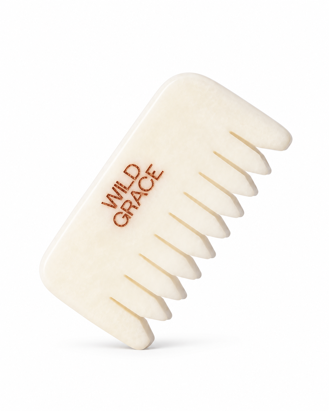White jade comb with 'Wild Grace' branding on a white background