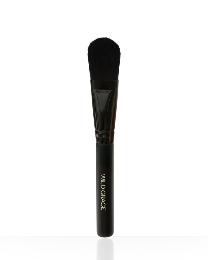 Makeup brush with black handle and bristle head on a white background, branded &