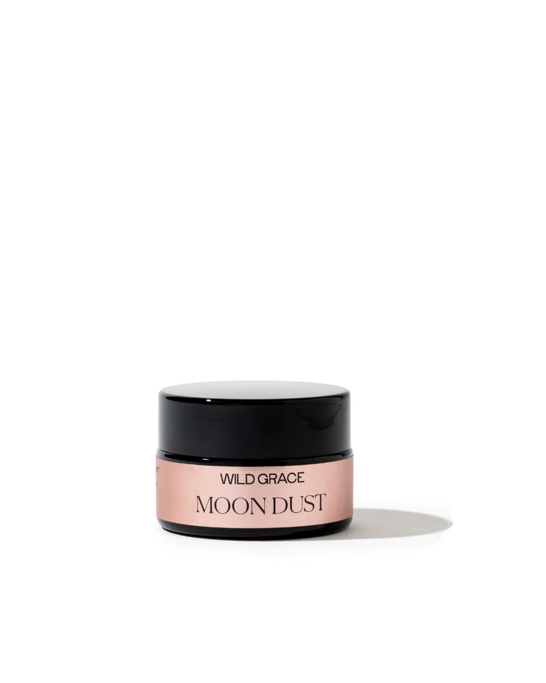 A small cosmetic jar labeled &