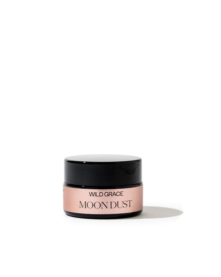 A small cosmetic jar labeled &