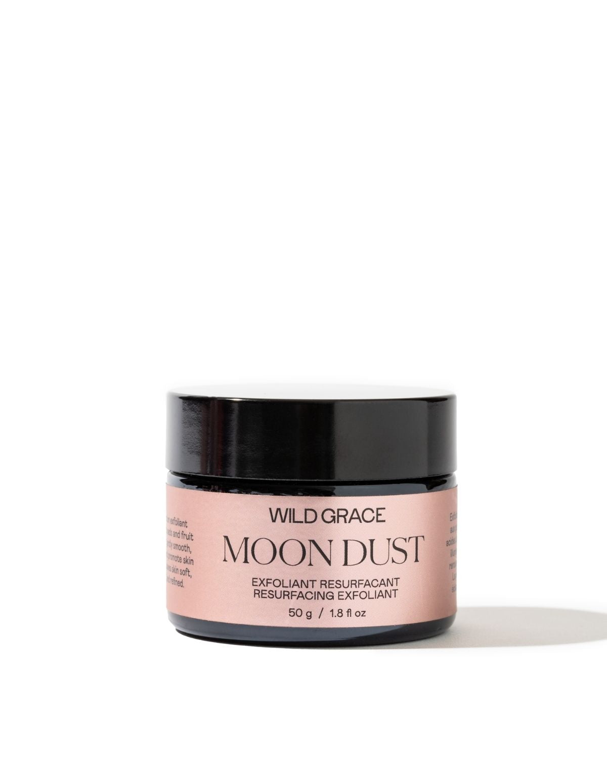 Cosmetic jar labeled 'Wild Grace Moon Dust' on a white background