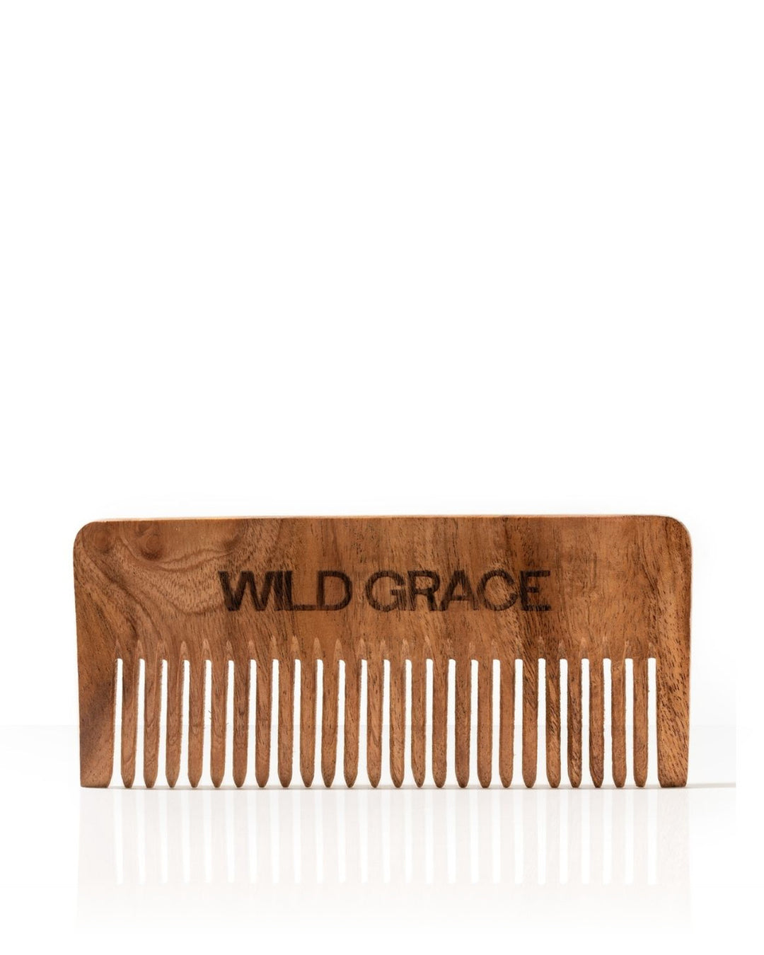 A wooden hair comb with the brand name &