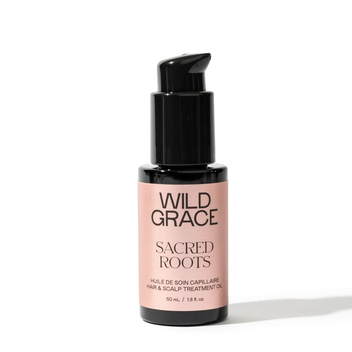 Bottle of Wild Grace Sacred Roots hair and scalp treatment oil on a white background