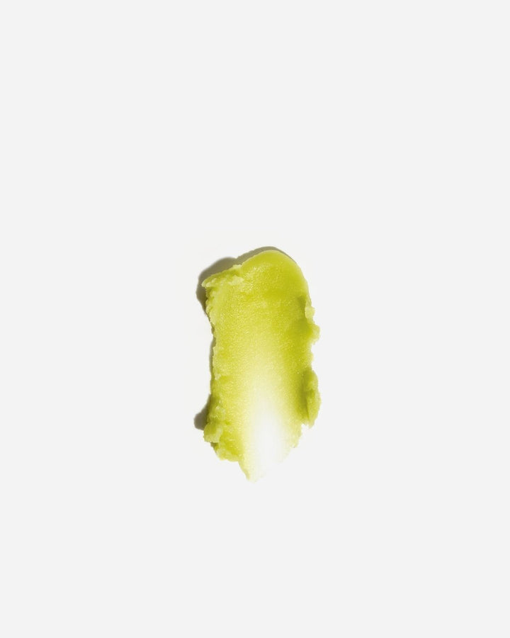 Green texture of deep forest cleansing balm on a white background