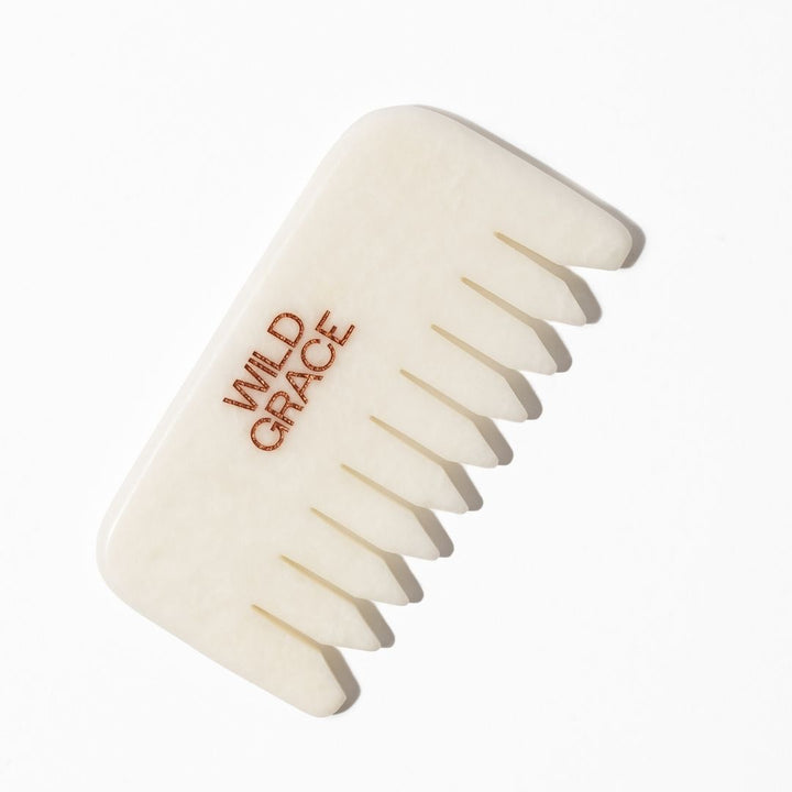 White jade comb with 'Wild Grace' branding on a white background