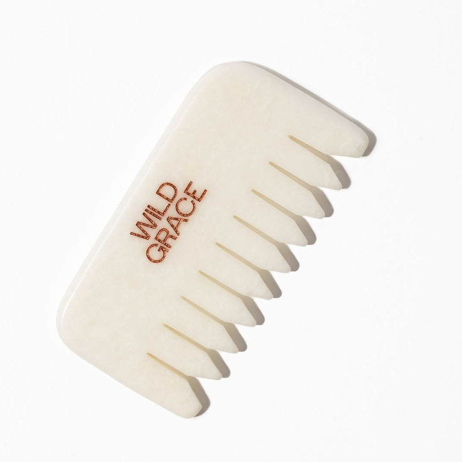 White jade comb with 'Wild Grace' branding on a white background