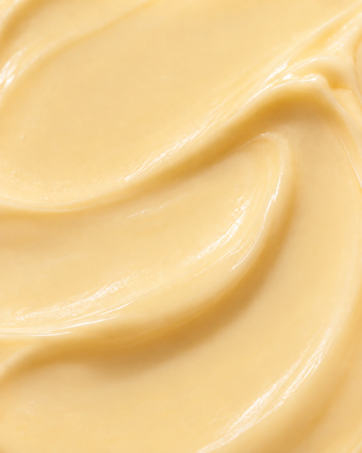 texture close-up of yellow solar glow cream by wild grace